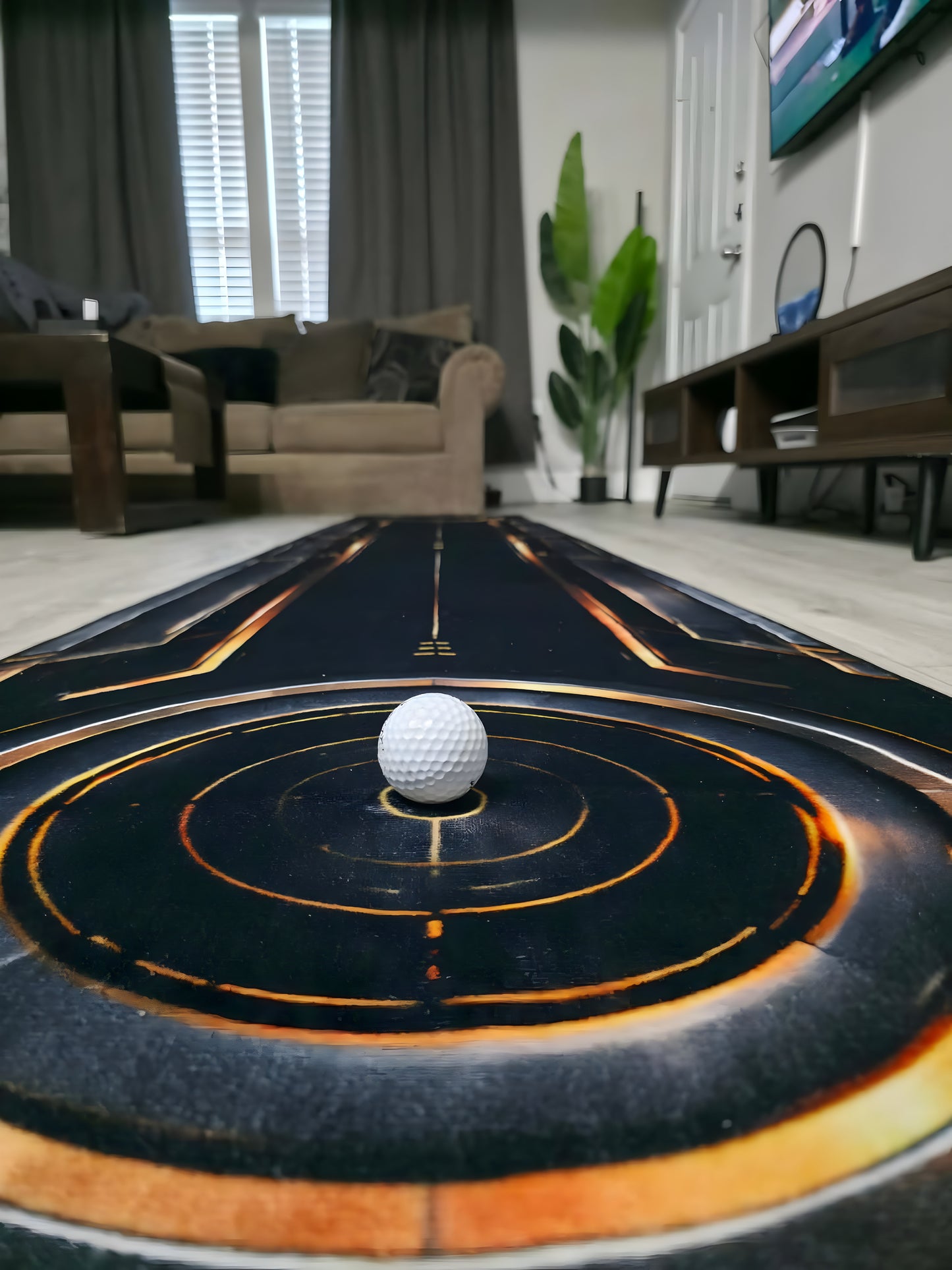 Eclipse™ designer putting rug in a modern living room with integrated putting green and alignment markings